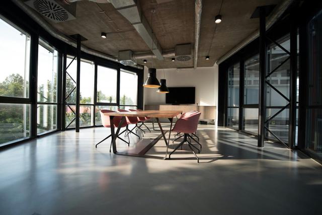 Modern conference room with wooden table and natural light