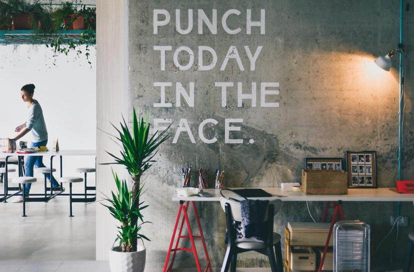 Motivation wall with 'PUNCH TODAY IN THE FACE' text